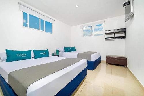 Postel nebo postele na pokoji v ubytování Hotel Marlon