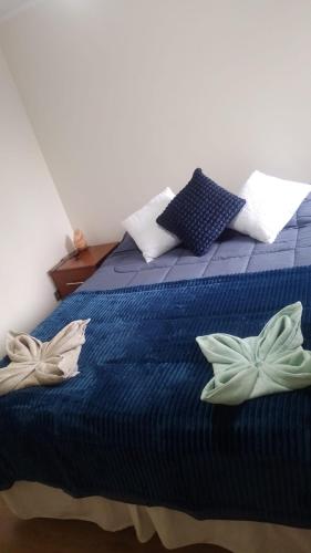 En eller flere senge i et værelse på Departamento nuevo, Temuco