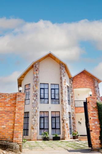 a brick building with windows on it at kigali Pillar House inn in Kigali