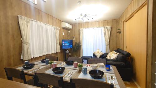 a living room with a table and a couch at 22minutes by car to Nagoya Station 2parking 