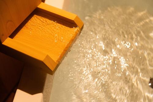a wooden block sitting on top of water at Morinest 北軽井沢 in Tsumagoi