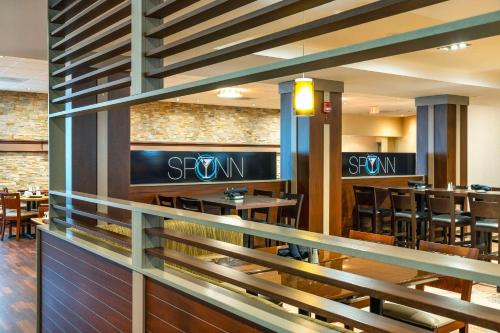 a dining room with tables and chairs in a restaurant at Allure Hotel & Conference Centre, Ascend Hotel Collection in Barrie