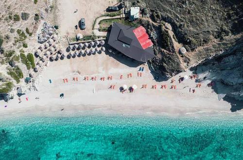 an overhead view of a beach with people on it at Lakeview Villa Nardi in Ksamil