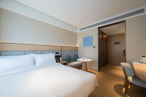 JI Hotel Beijing Xizhimen Jiaotong Universityにあるベッド