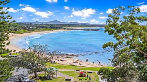 a view of a beach with people in the water at Whitesands 501 in Forster
