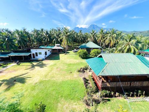 an aerial view of a resort with palm trees at Taylors Plantacion Resort- Bungalow Villa in Catarman