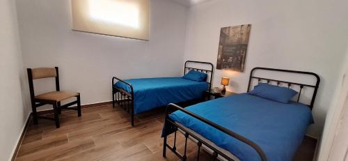 En eller flere senge i et værelse på Casa Cor do Vinho