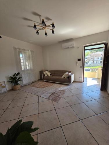 a living room with a couch and a ceiling fan at B612 bed & breakfast APPARTAMENTO Piccolo Principe in Manoppello
