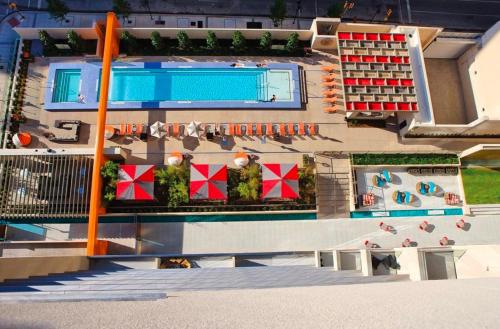 an aerial view of a building with a swimming pool at City View Downtown Dallas High Rise Condo with Free Parking, Gym, Pool in Dallas