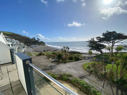 a view of the ocean from a balcony at Tide Watch - Mount Brioni in Downderry