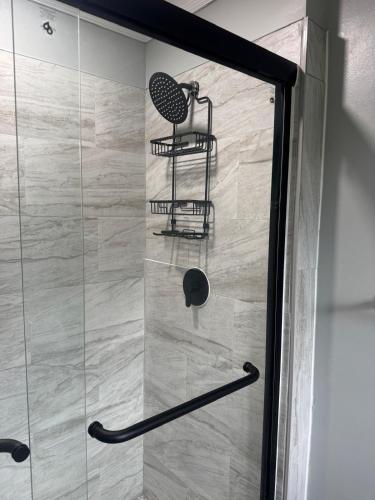 a shower with a chair in a bathroom at Beautiful home with mountain top views with an EV and NEMA connection!! in Poughkeepsie