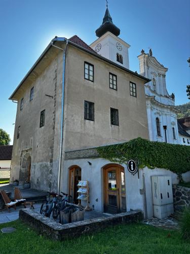 an old building with bikes parked in front of it at Gostilna Menina in Gornji Grad