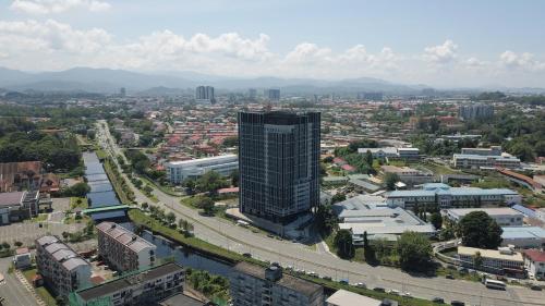 an aerial view of a city with a tall building at KWEN Vetro11 - Charm of KK City in Kota Kinabalu