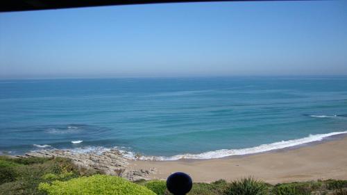 a view of a beach with the ocean at Villa L'Arche in Bidart