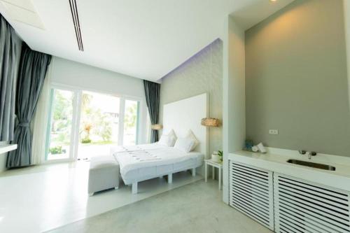 Una cama o camas en una habitación de Kochira