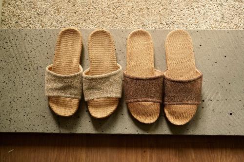 a group of three pairs of shoes sitting on a counter at Pyoseon Mansion in Seogwipo