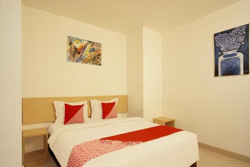 Кровать или кровати в номере Collection O Palembang near Palembang Indah Mall formerly Hostel 77 Smart