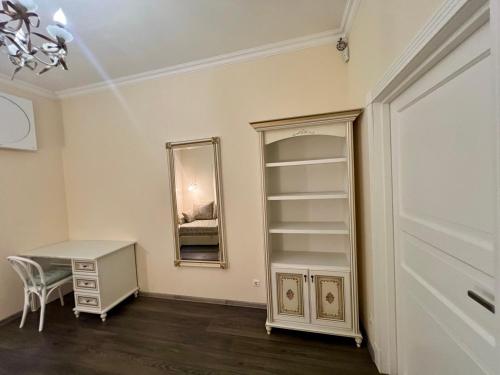 a room with a mirror and a desk and a dresser at Apartment - Independence Square in Kyiv