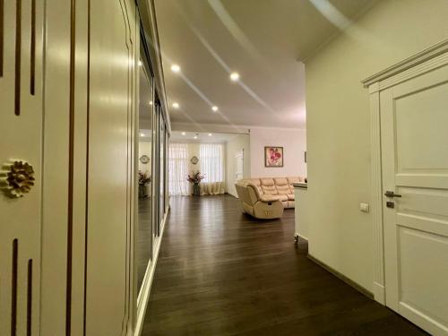 a hallway with a living room with a couch at Apartment - Independence Square in Kyiv