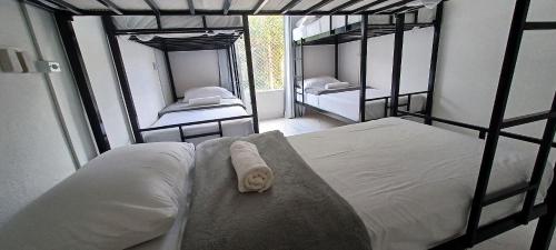 a bedroom with two bunk beds with a towel at Casa Ibirapuera - Hospedagem Domiciliar in Sao Paulo