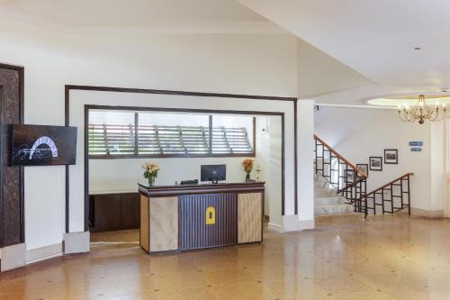an office with a desk with a letter a on it at Gateway Varkala in Varkala