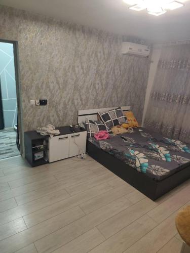 a bedroom with a bed and a desk in a room at Blue Horizon Apartments 