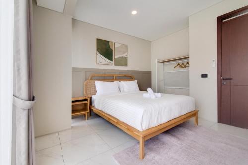 Ένα ή περισσότερα κρεβάτια σε δωμάτιο στο 3BR Villa Punawangi With Jacuzzi