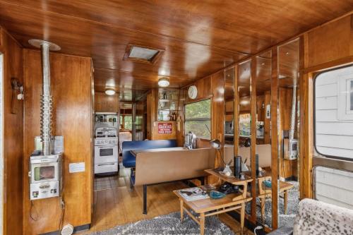 an interior view of an rv kitchen and living room at Ashtabula Cottage & RV-Minutes from Covered Bridges & Wineries in Ashtabula