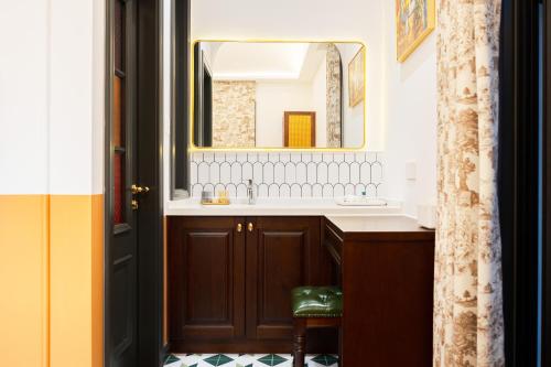 a bathroom with a sink and a mirror at Luxury Riverside House with Garden in Central Suzhou in Suzhou