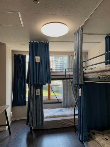 Katil atau katil-katil dalam bilik di Fukuoka Tabiji Hostel & Guesthouse