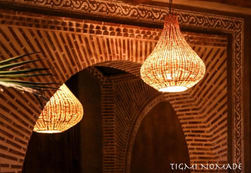 two chandeliers hanging from the ceiling in a room at Tigmi Nomade in Tahannout