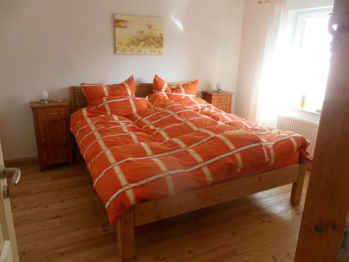 En eller flere senge i et værelse på Schön wohnen in der Rhön