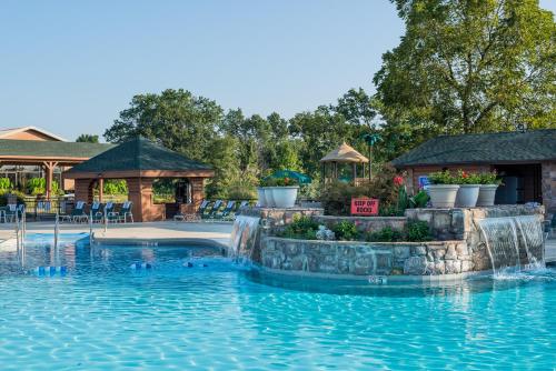 a pool at a resort with a water slide at Westgate Branson Woods Resort in Branson