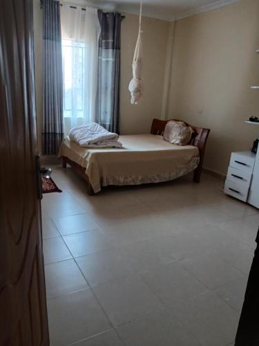 Ένα ή περισσότερα κρεβάτια σε δωμάτιο στο Muna's Hacienda