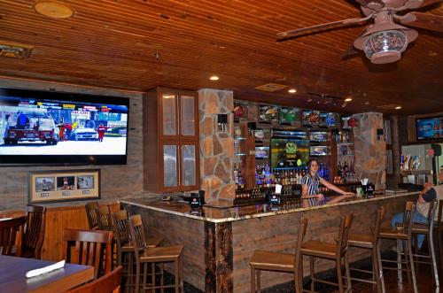 a woman standing at a bar in a restaurant at Westgate Branson Woods Resort in Branson