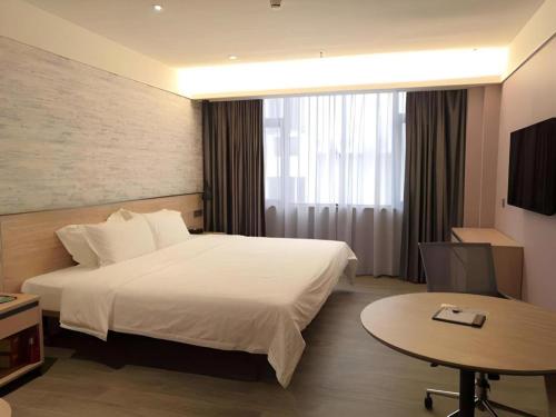 Cama o camas de una habitación en Shenzhen Hanyong Hotel Fuyong Branch