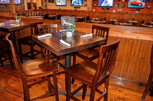 a wooden table and chairs in a restaurant at Westgate Branson Woods Resort in Branson