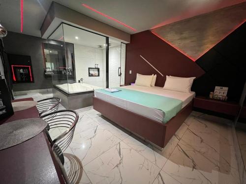Ένα ή περισσότερα κρεβάτια σε δωμάτιο στο A2 Motel Araras