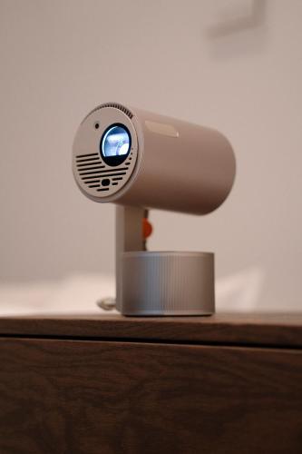a webcam sitting on top of a wooden table at Cava House in Tokyo