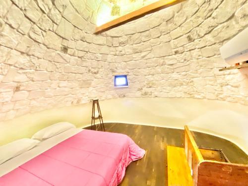 Postel nebo postele na pokoji v ubytování Trulli Bovio