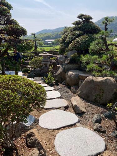 a stepping stone pathway in a japanese garden at 蒼々さぬき志度 SOUSOU Sanuki Shido in Sanuki