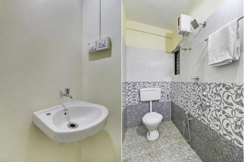 a bathroom with a sink and a toilet at Hotel O Sai Executive Lodging in Māngvādi