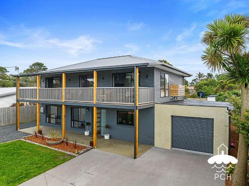 an image of a house with a balcony at Fishermans Stay 
