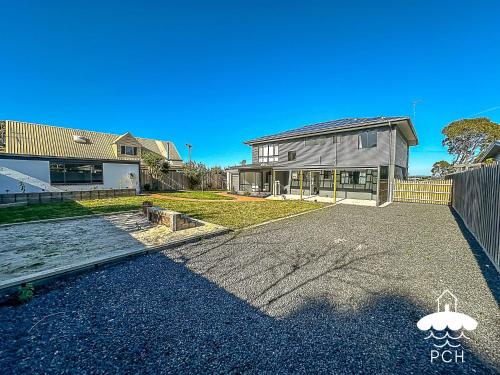 an empty driveway in front of a house at Fishermans Stay 