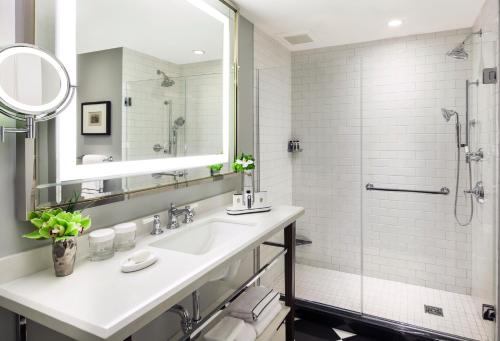 a bathroom with a sink and a shower at InterContinental New York Barclay Hotel by IHG in New York