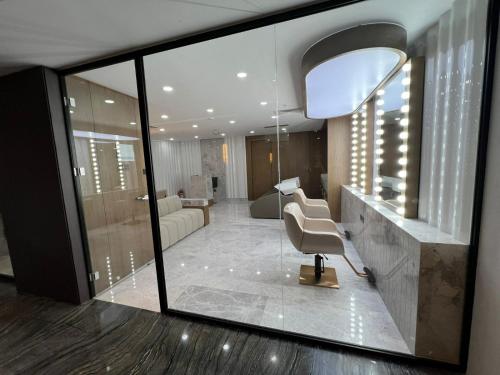 a lobby with a chair and a living room at Chamada Girne Hotel Spa and Casino in Kérynia