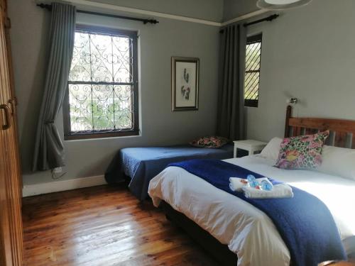 Postel nebo postele na pokoji v ubytování Die Tuis Huis Selfcatering NO LOADSHEDDING