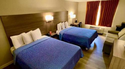 Ένα ή περισσότερα κρεβάτια σε δωμάτιο στο Econo Lodge