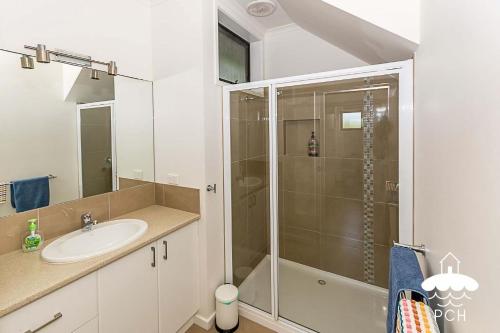a bathroom with a shower and a sink at 37 Oceanview Parade Sandy Point in Sandy Point