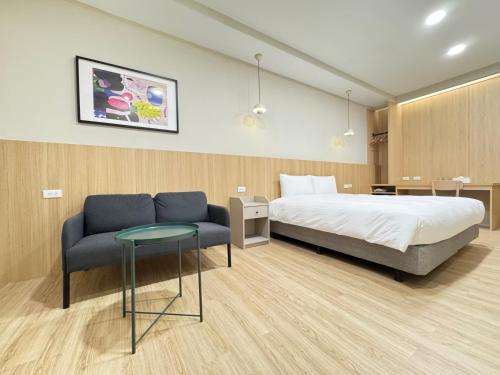 Postel nebo postele na pokoji v ubytování Yoshi Hotel - Tainan Sinmei Branch